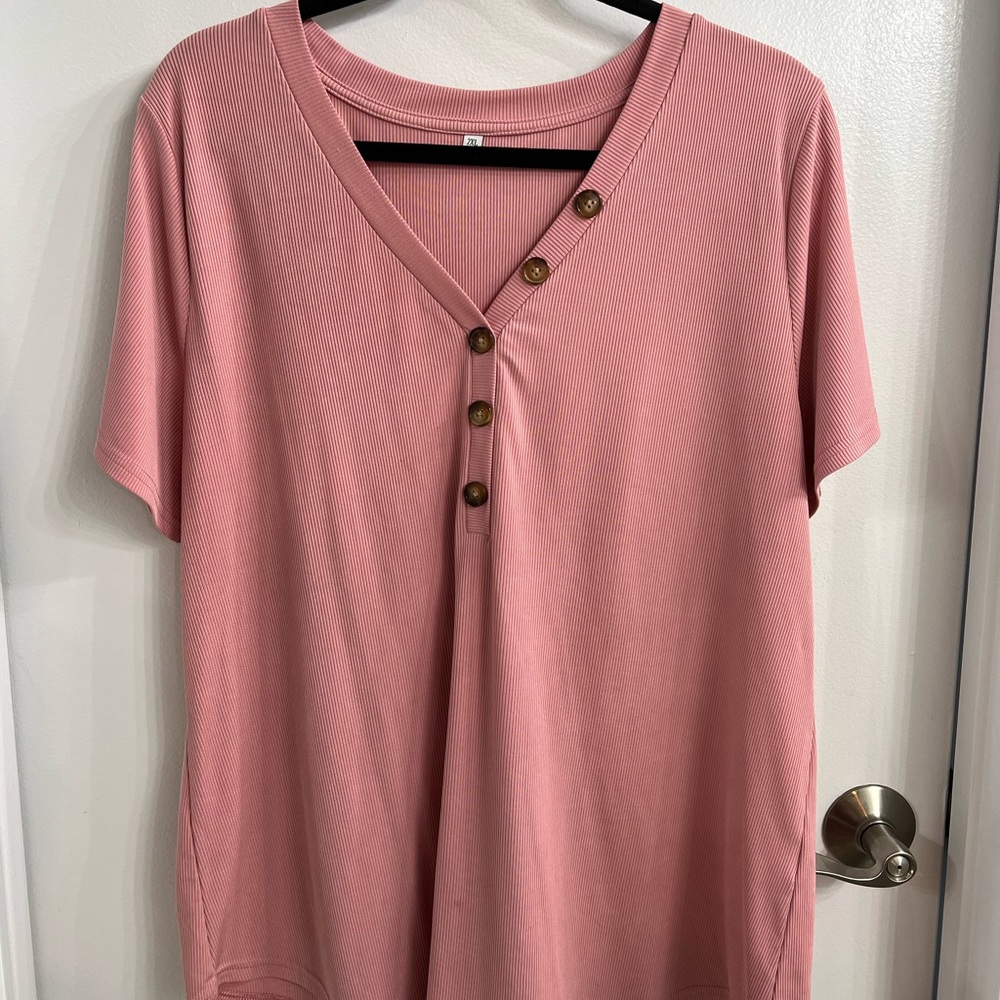 Short sleeve pink top, with button detail.